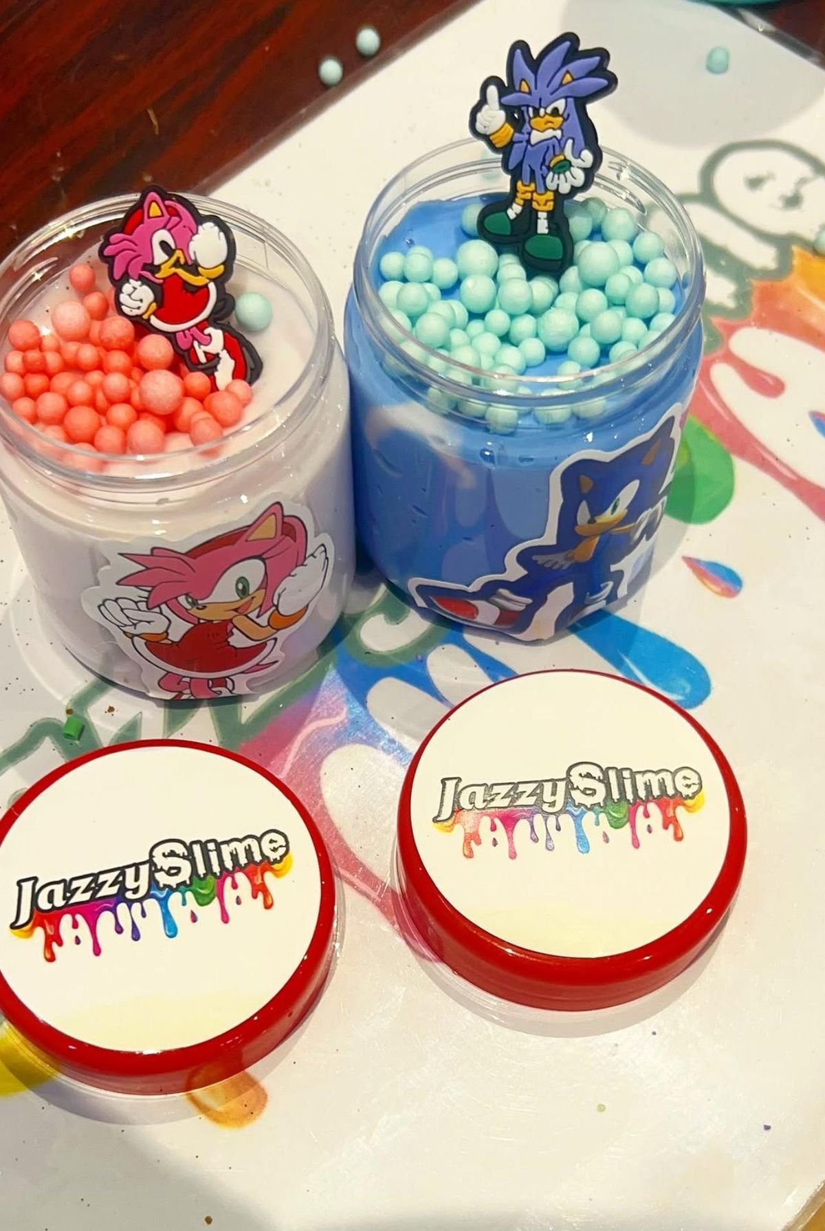Jazzy Slime pots decorated with astronaut charms