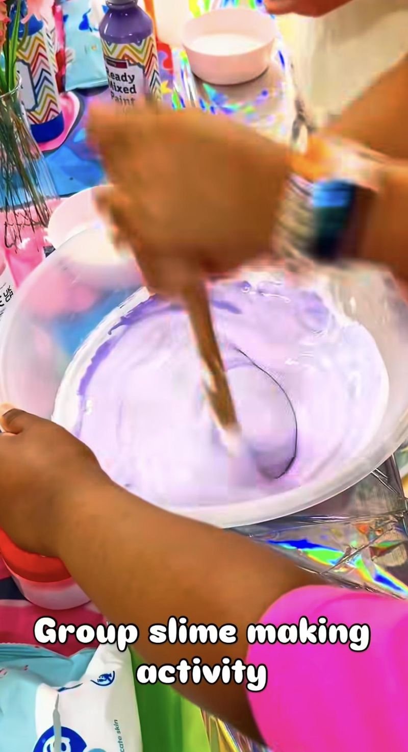 Kids mixing a giant batch of slime together as a group activity